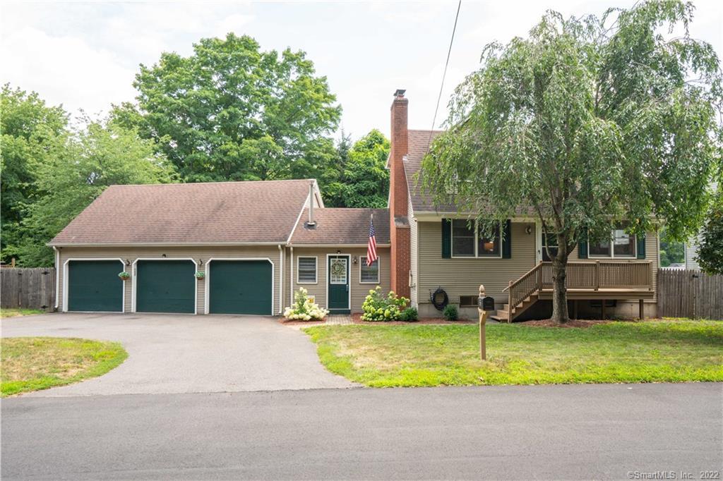 36 Pond Road Windsor, CT 06095 - Photo 1 of 1 a house that has a lot of plants in it
