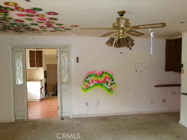 17392 Cache Creek Road Clearlake Oaks, CA 95423 - Photo 16 of 25 a bedroom with a bed and ceiling fan