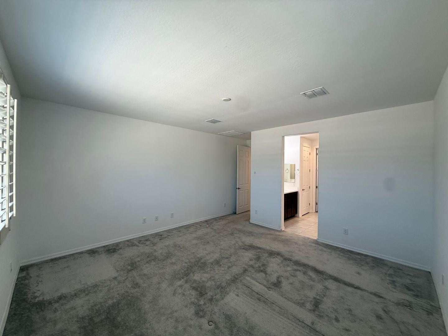 15744 West Jefferson Street Goodyear, AZ 85338 - Photo 17 of 26 an empty room with windows