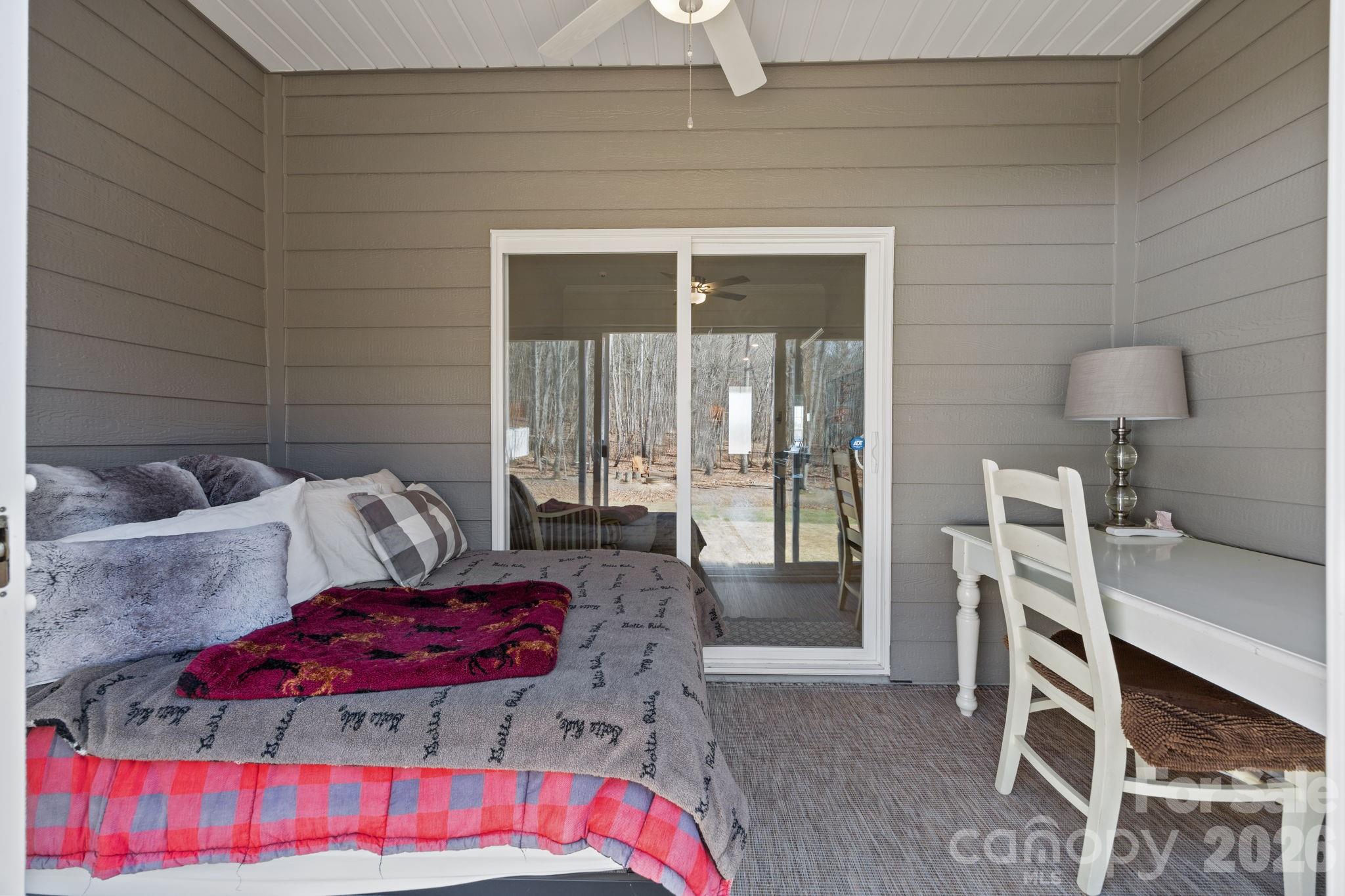 181 Brixham Loop Troutman, NC 28166 - Photo 21 of 28 a bedroom with furniture and a large window