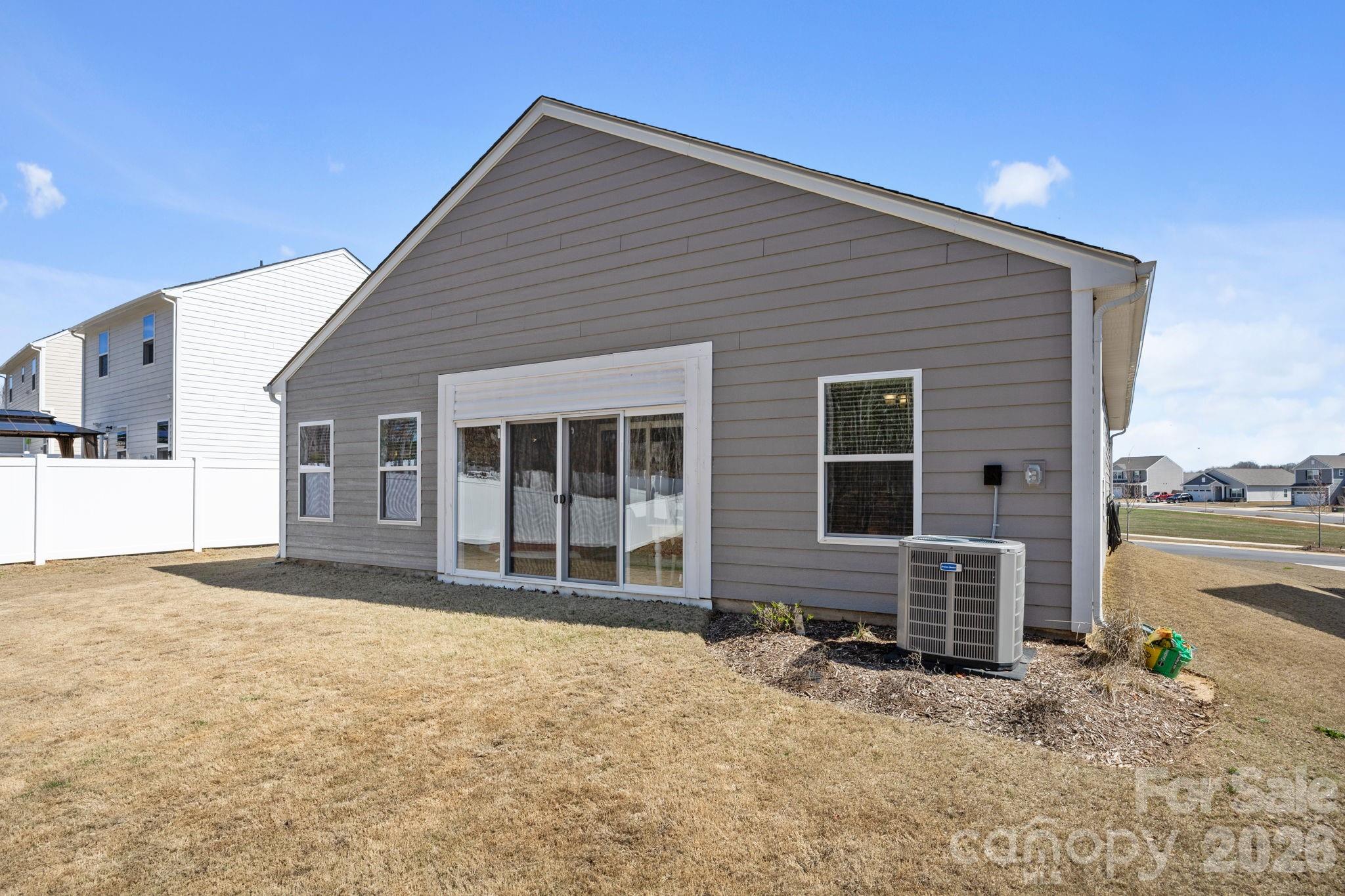 181 Brixham Loop Troutman, NC 28166 - Photo 22 of 28 a front view of a house with a yard