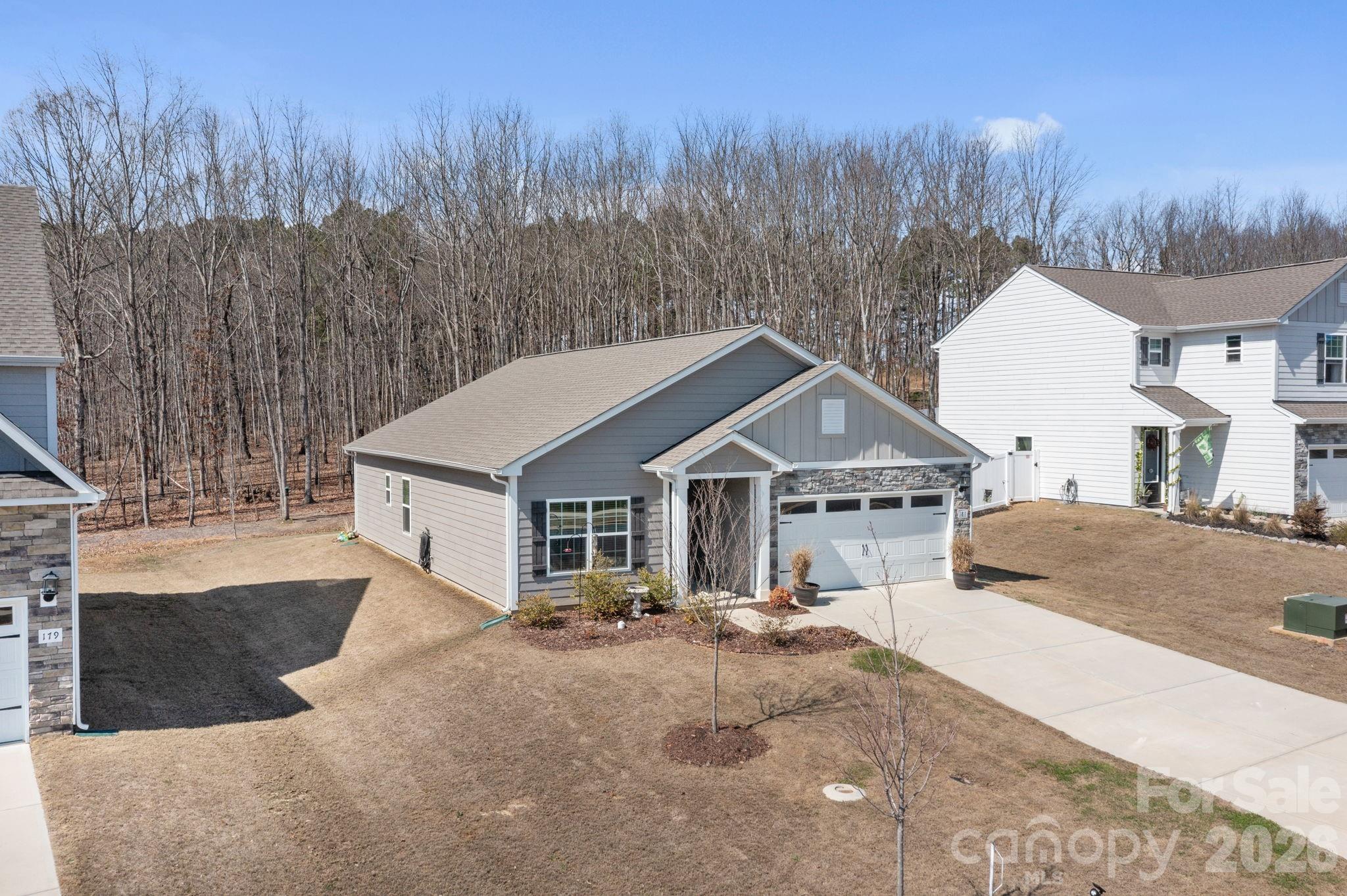 181 Brixham Loop Troutman, NC 28166 - Photo 27 of 28 a house with a tree in front of it