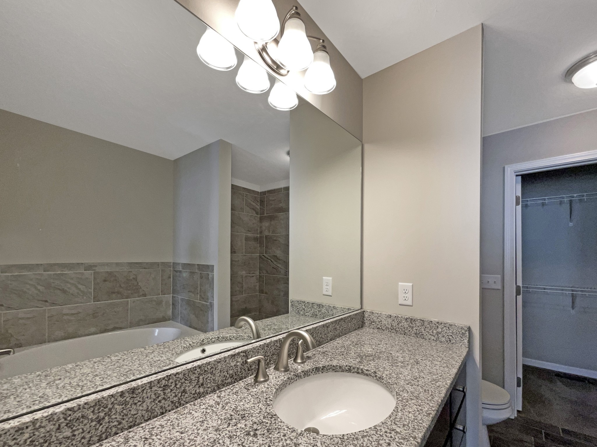 1382 Rural Hill Road, Unit 364 Antioch, TN 37013 - Photo 18 of 22 a bathroom with a granite countertop sink and a mirror
