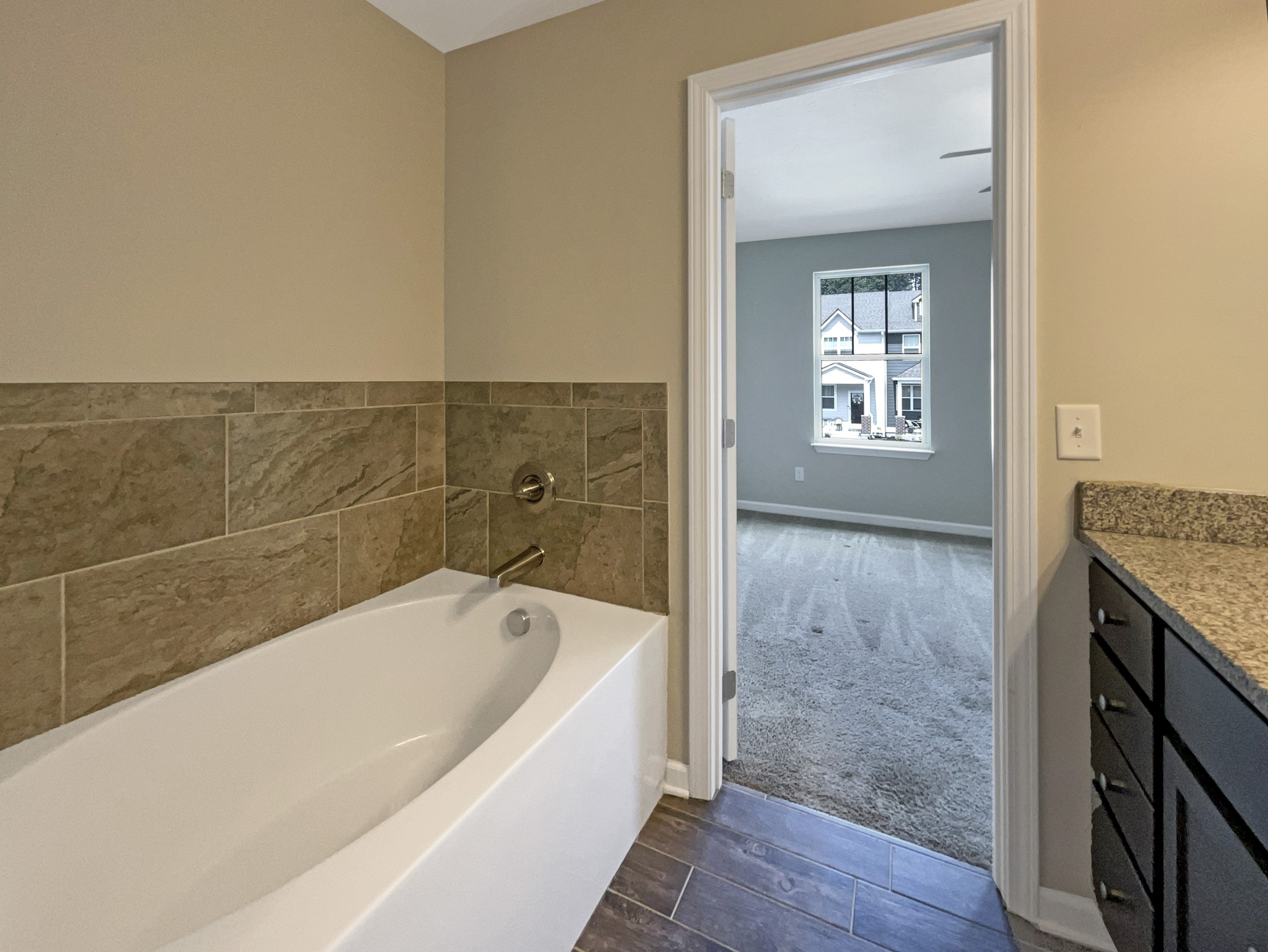 1382 Rural Hill Road, Unit 364 Antioch, TN 37013 - Photo 19 of 22 a spacious bathroom with a granite countertop bathtub sink and mirror