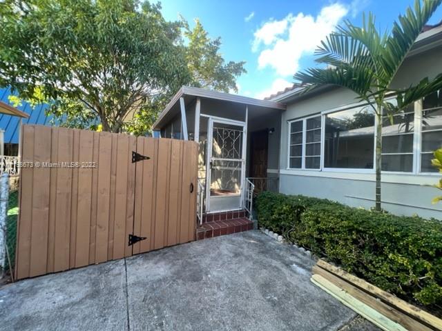 West Flagler Miami, FL 33126 - Photo 10 of 21 a view of backyard with potted plants and a large tree