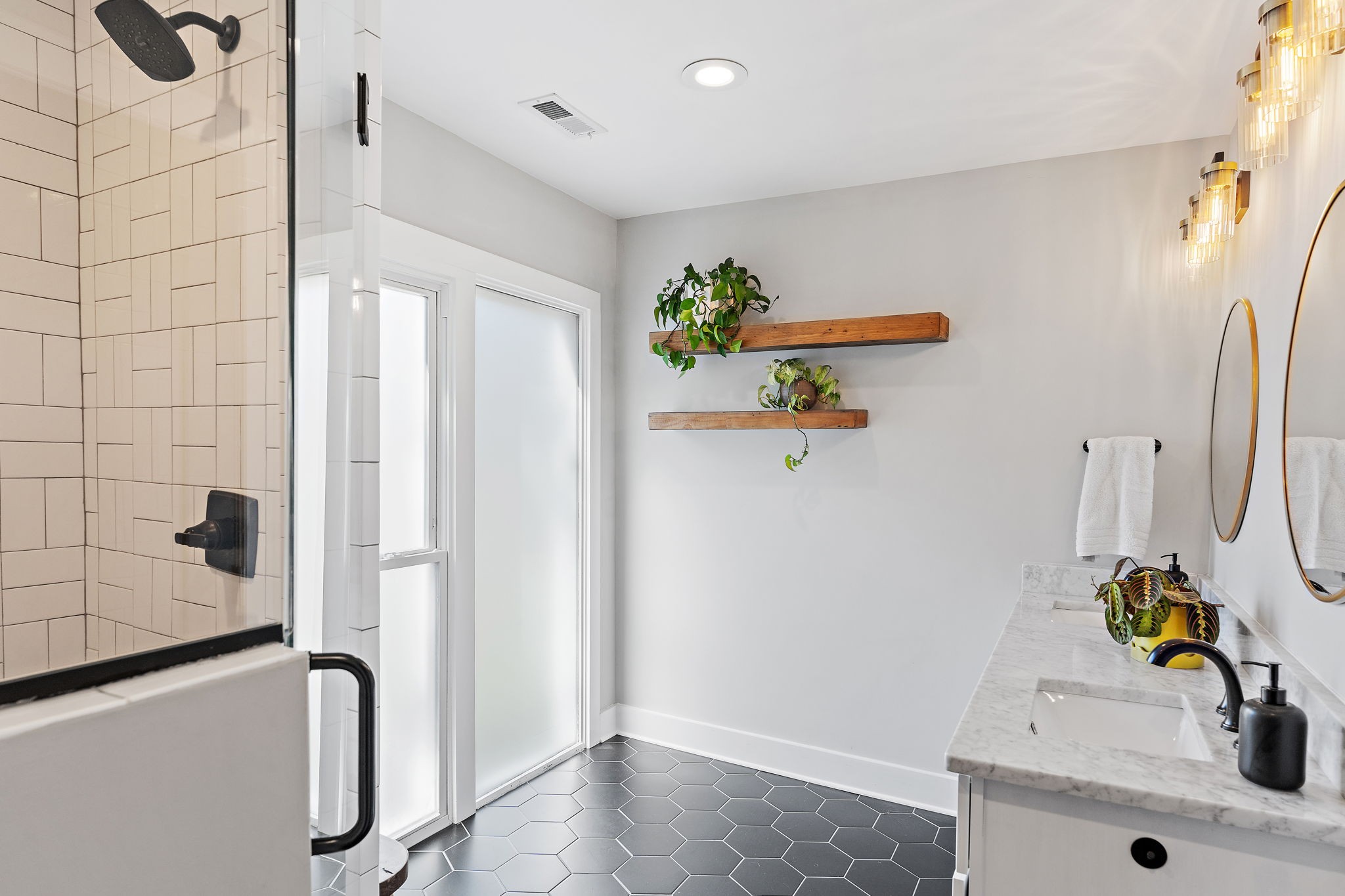 1058 Gwynn Drive Nashville, TN 37216 - Photo 20 of 36 a bathroom with a sink and mirror