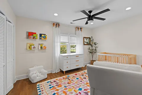 a bedroom with furniture and a window