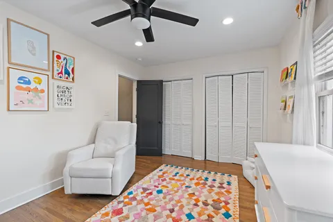 a bedroom with furniture and a chandelier