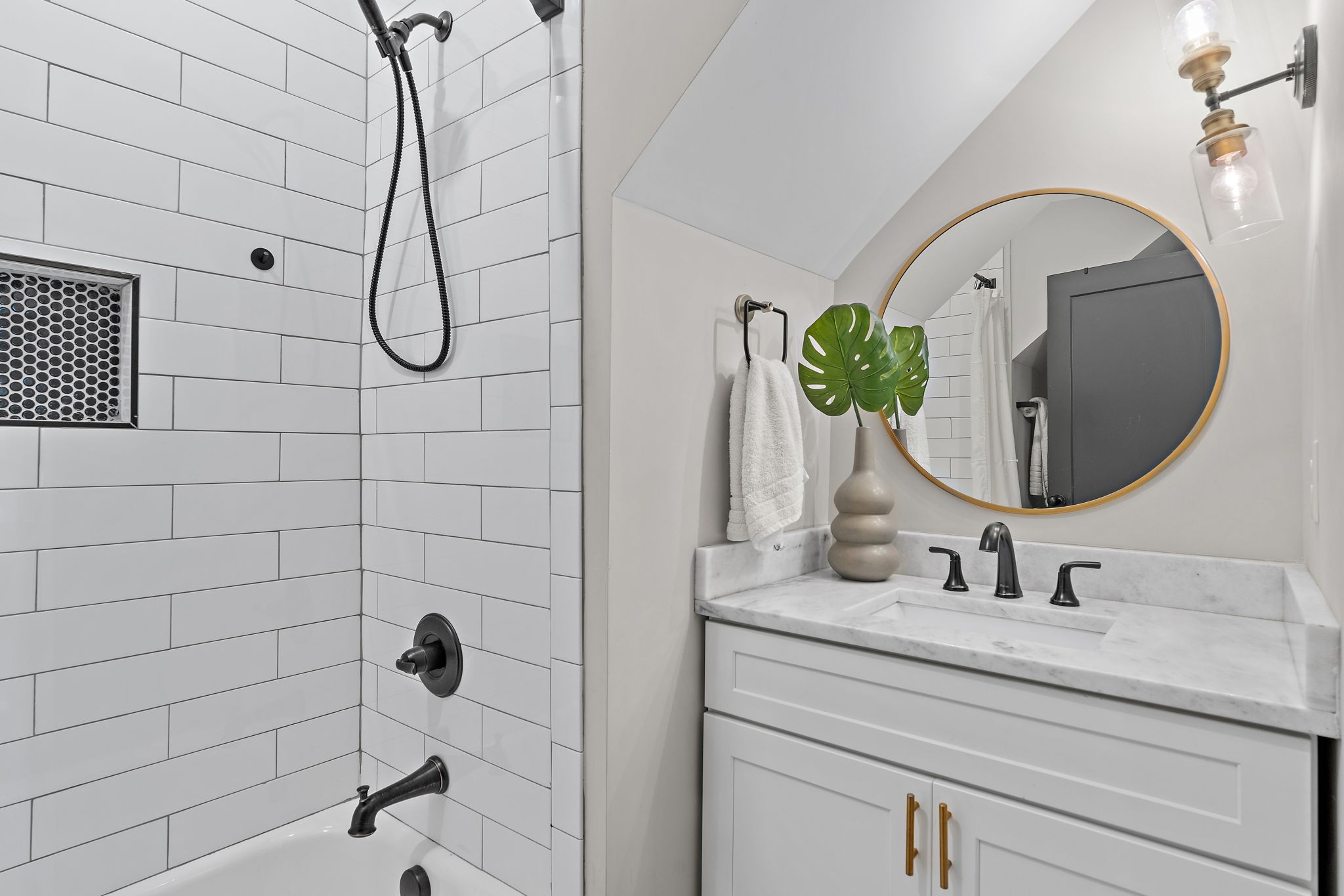 1058 Gwynn Drive Nashville, TN 37216 - Photo 24 of 36 a bathroom with a sink a mirror and shower