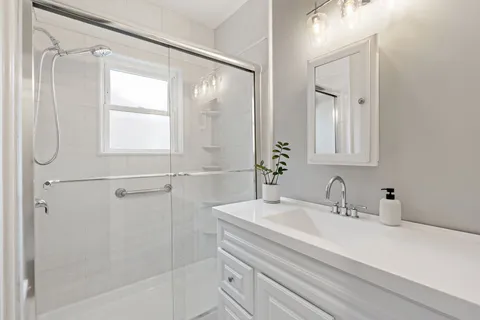 a bathroom with a sink and a mirror