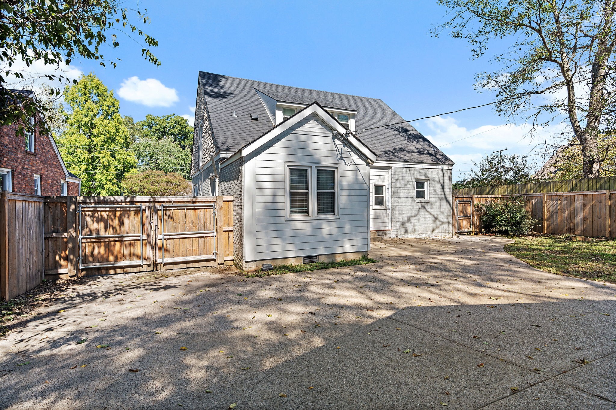 1058 Gwynn Drive Nashville, TN 37216 - Photo 33 of 36 front view of a house with a large tree and a yard