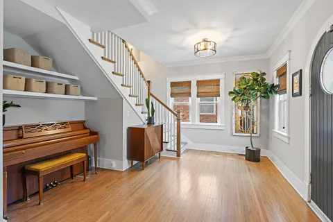 a view of an entryway with wooden floor