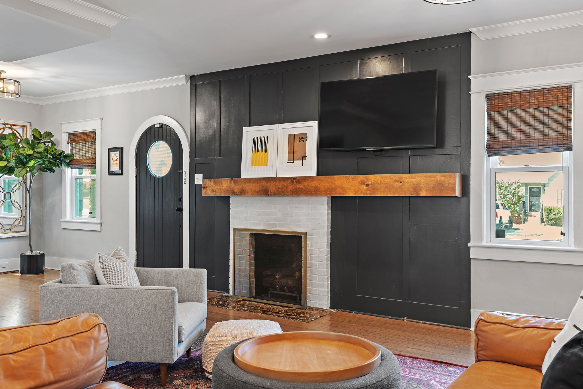 1058 Gwynn Drive Nashville, TN 37216 - Photo 9 of 36 a living room with furniture a flat screen tv and a fireplace