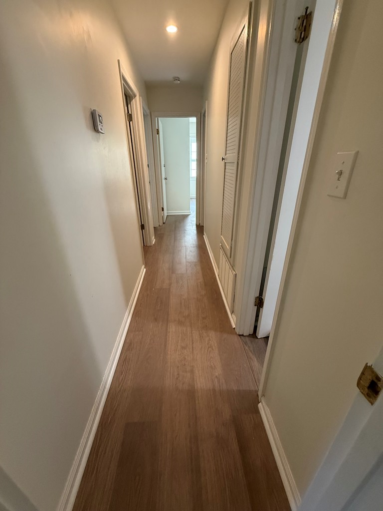 4355 Byron Street Columbus, GA 31907 - Photo 12 of 20 a view of a hallway with wooden floor and staircase