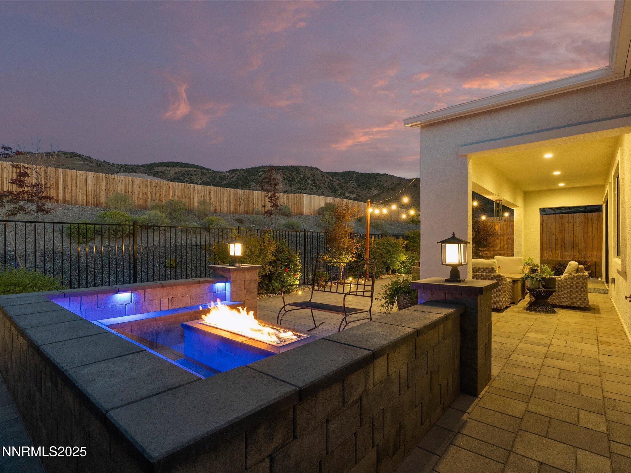 a outdoor dining space with furniture and city view