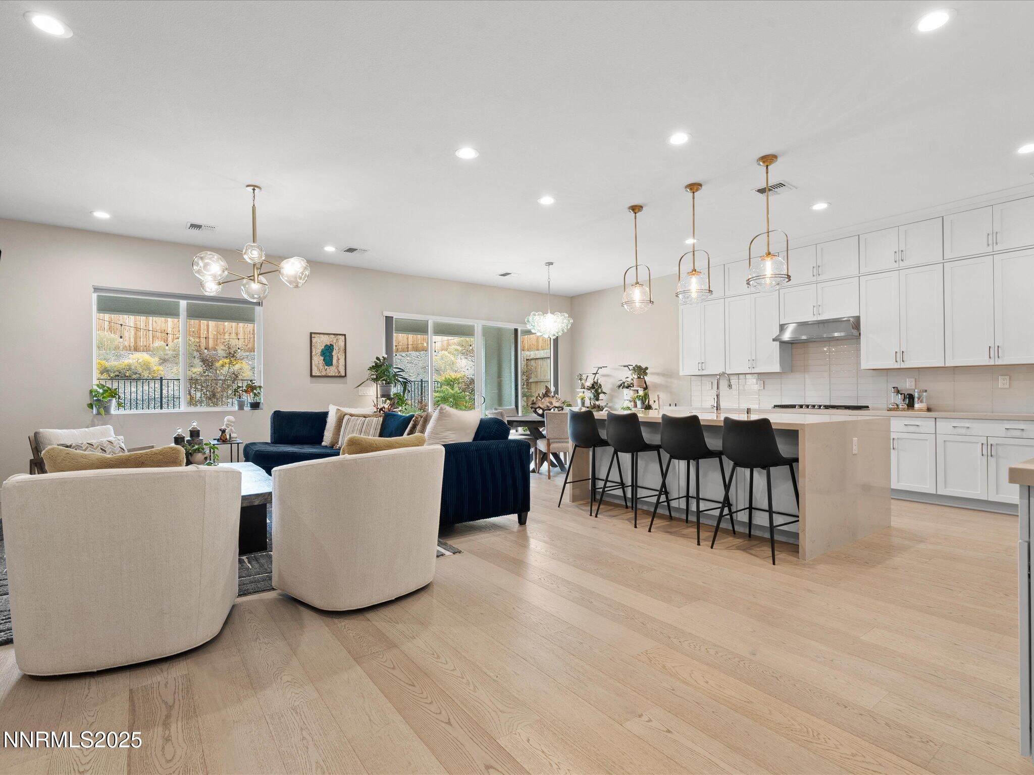 15026 Iron River Drive Reno, NV 89521 - Photo 3 of 26 a living room with furniture and kitchen view