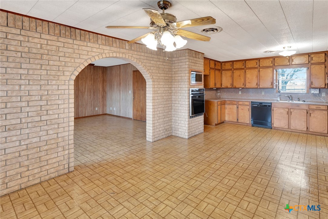 1840 Loop 522 Ganado, TX 77962 - Photo 12 of 48 a view of a kitchen with a sink and cabinets