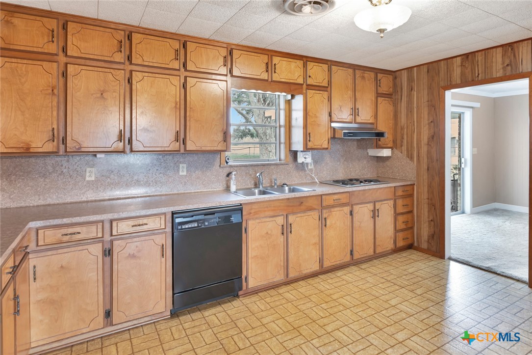 1840 Loop 522 Ganado, TX 77962 - Photo 15 of 48 a kitchen with granite countertop white cabinets and white appliances