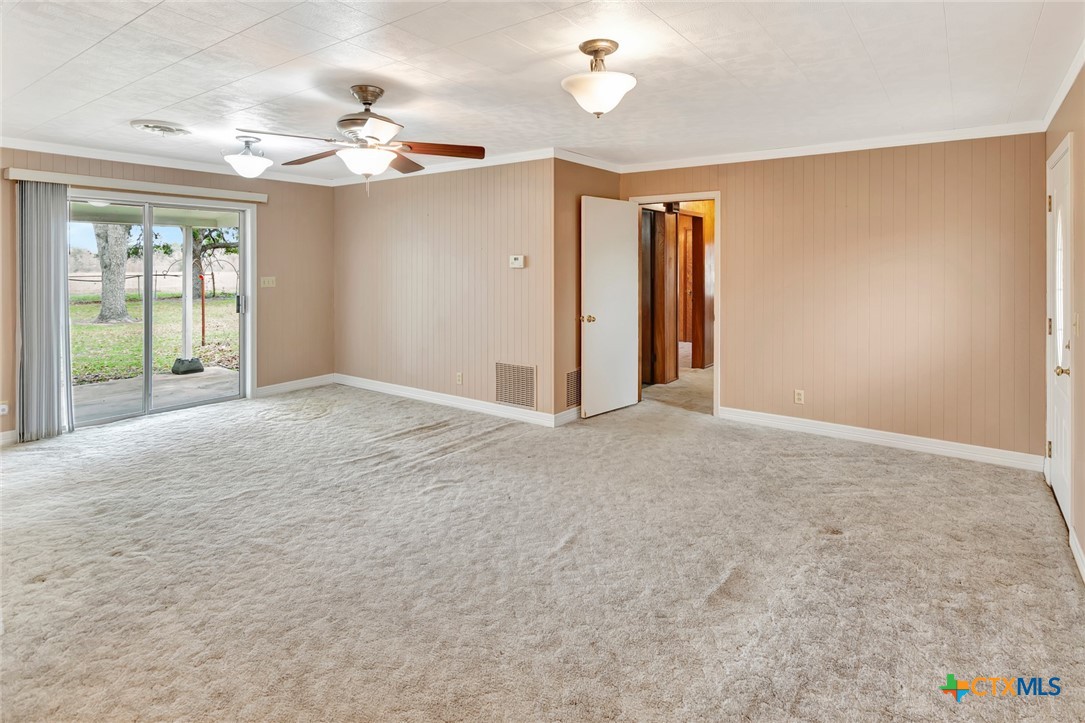 1840 Loop 522 Ganado, TX 77962 - Photo 22 of 48 a view of a livingroom with a chandelier fan