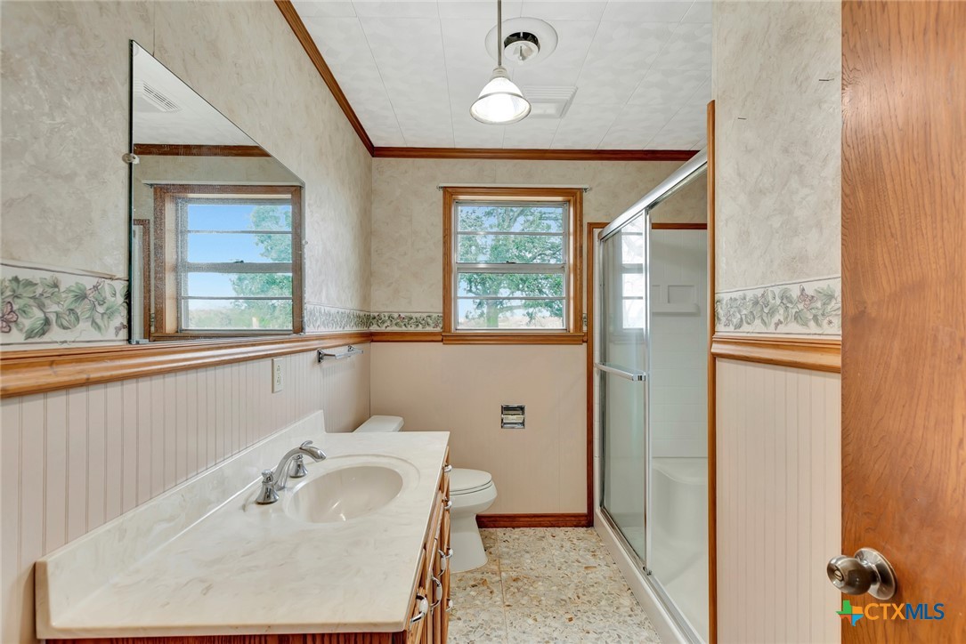 1840 Loop 522 Ganado, TX 77962 - Photo 27 of 48 a bathroom with a sink and a mirror