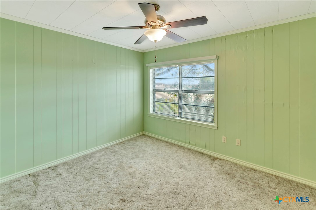 1840 Loop 522 Ganado, TX 77962 - Photo 30 of 48 an empty room with a window and a ceiling fan
