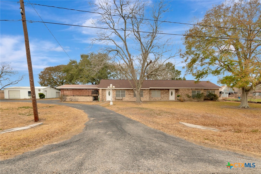 1840 Loop 522 Ganado, TX 77962 - Photo 3 of 48 a front view of a house with a yard