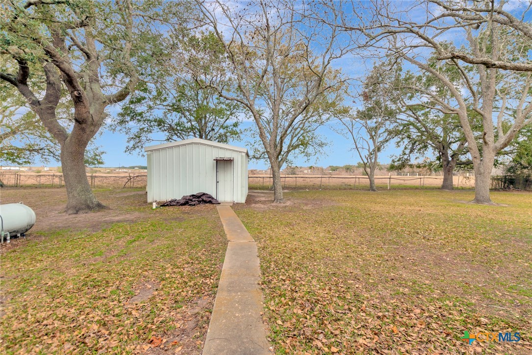 1840 Loop 522 Ganado, TX 77962 - Photo 45 of 48 a view of a house with backyard and tree