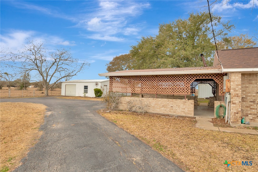 1840 Loop 522 Ganado, TX 77962 - Photo 5 of 48 a front view of a house with garden