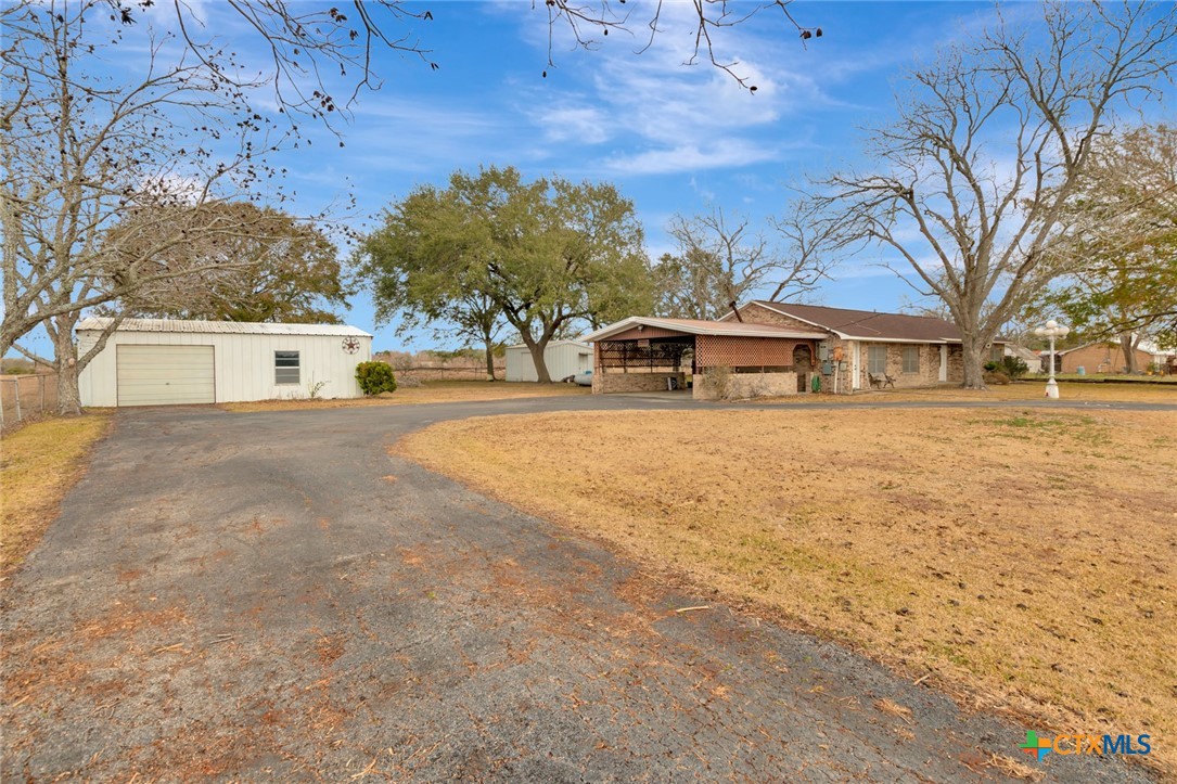 1840 Loop 522 Ganado, TX 77962 - Photo 7 of 48 a view of a house with a yard and trees