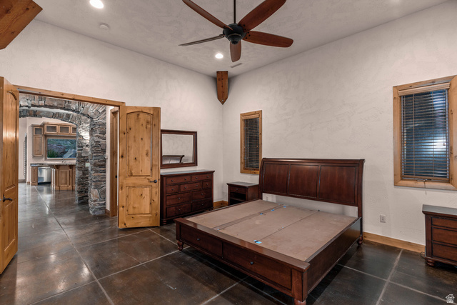 2464 East Granite Way St. George, UT 84790 - Photo 31 of 106 Primary Suite featuring ceiling fan, recessed lighting, and a textured wall