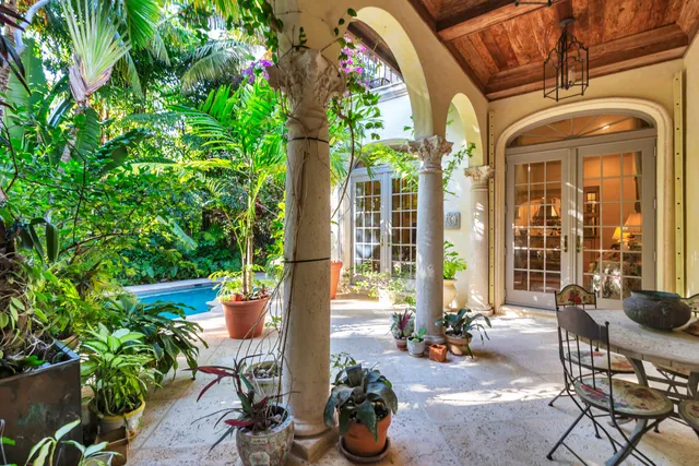 a front view of a house with outdoor seating