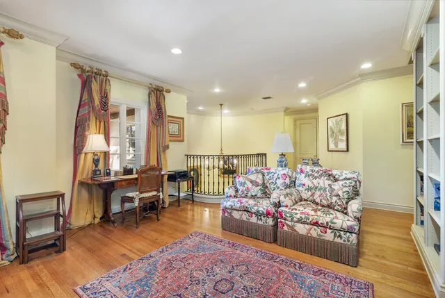 a living room with furniture and a rug
