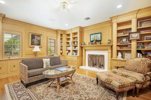 a living room with furniture and a fireplace