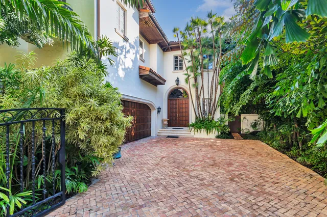 an aerial view of residential houses with city view