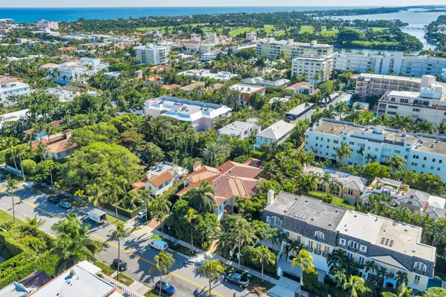 an aerial view of a house with a yard and garden
