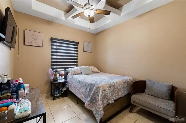 a bathroom with a granite countertop sink a mirror and a toilet