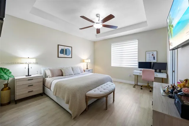 a bedroom with a bed and a table