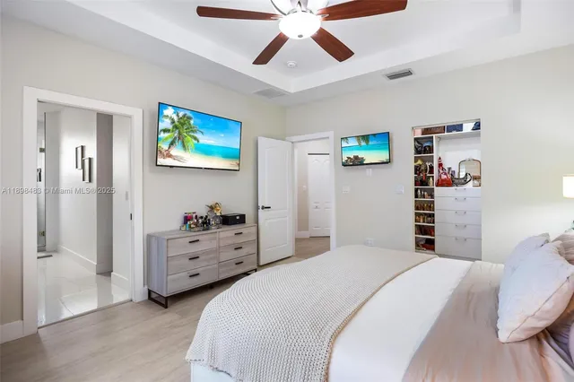 a bedroom with a bed and a cabinets