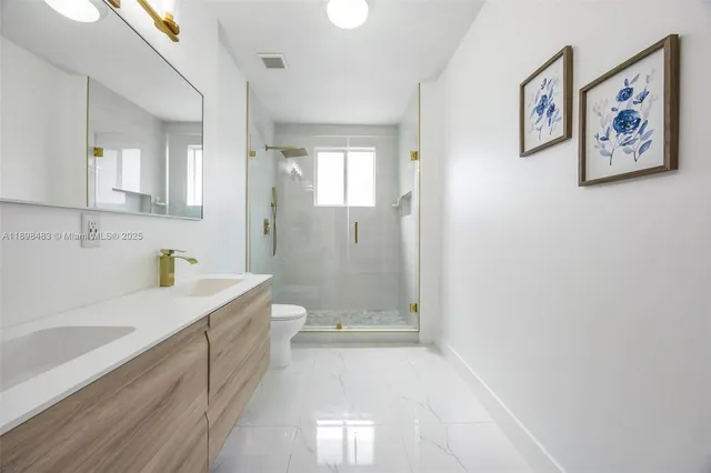 a bathroom with a tub a sink and shower