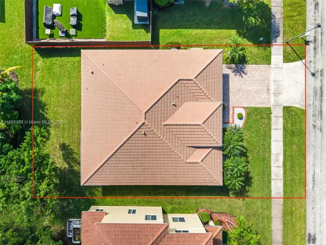 an aerial view of a house with garden