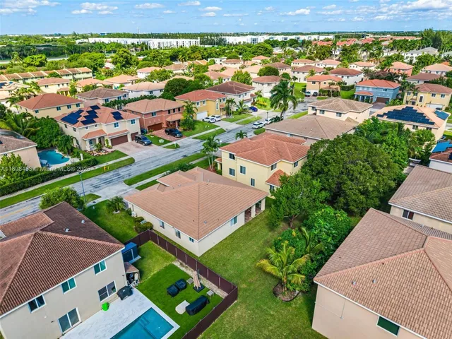 an aerial view of a house with a garden