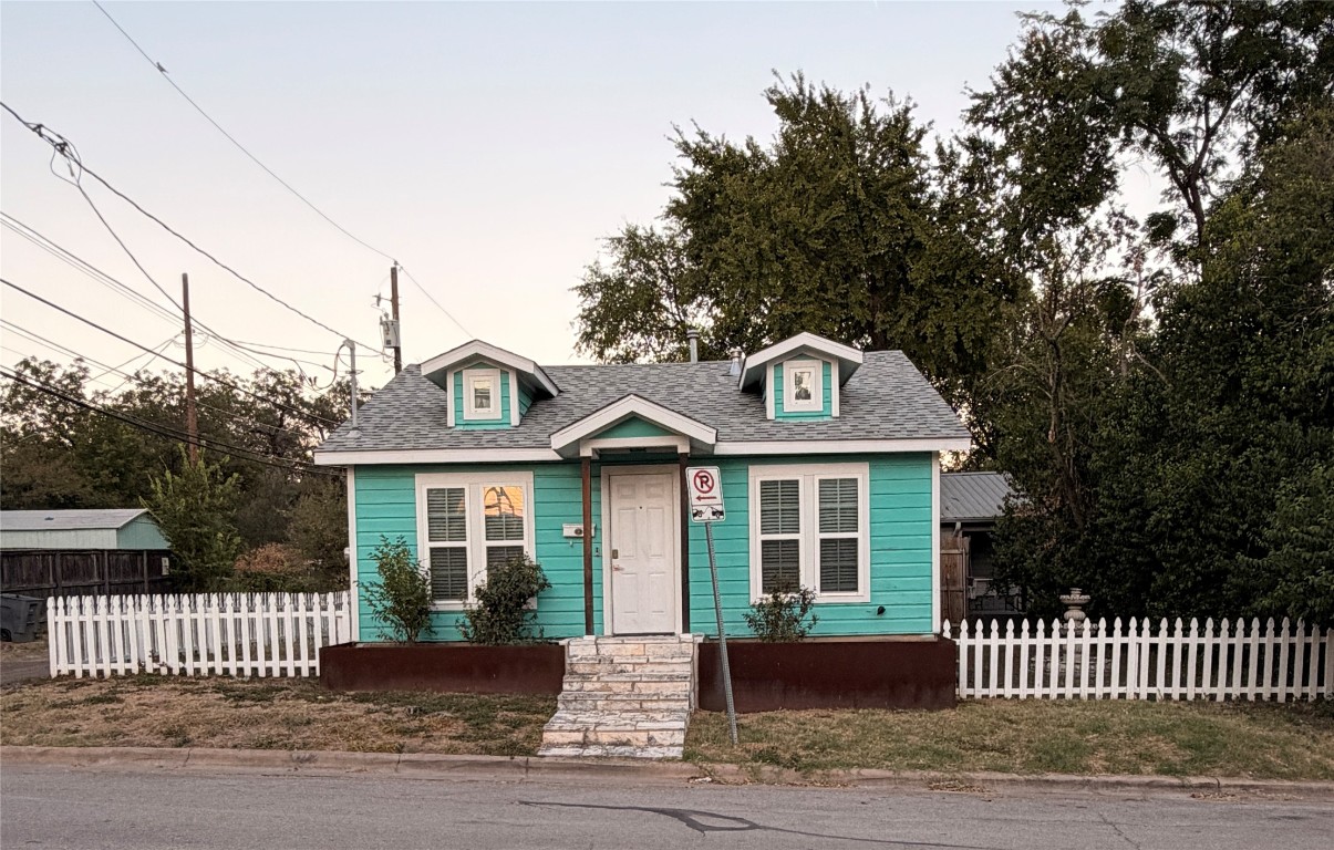 1305 Olander Street Austin, TX 78702 - Photo 14 of 14 a front view of a house with a garden