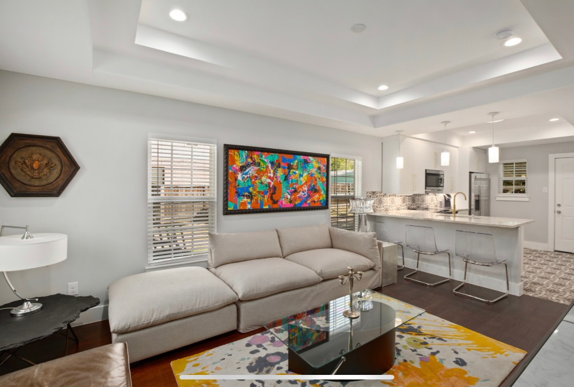 1305 Olander Street Austin, TX 78702 - Photo 2 of 14 a living room with furniture and a flat screen tv