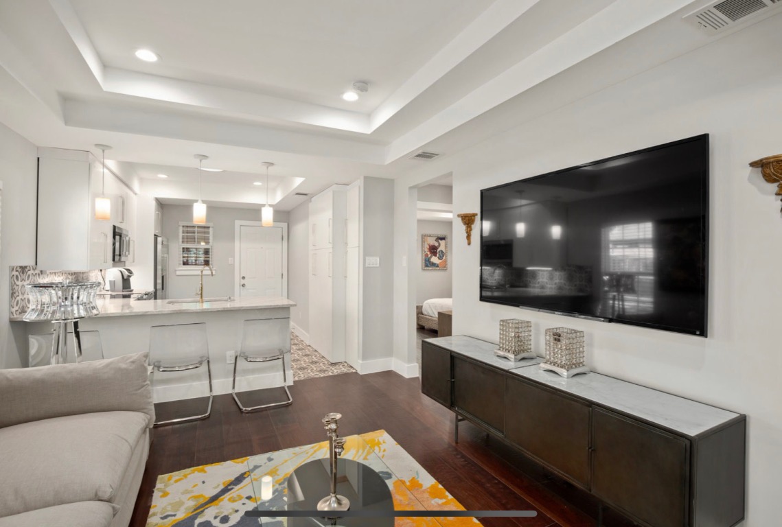 1305 Olander Street Austin, TX 78702 - Photo 5 of 14 a living room with furniture and a flat screen tv