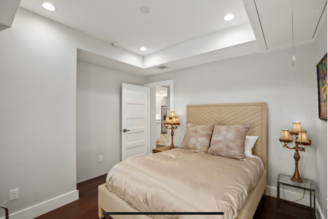 1305 Olander Street Austin, TX 78702 - Photo 10 of 14 a bedroom with a bed and a potted plant