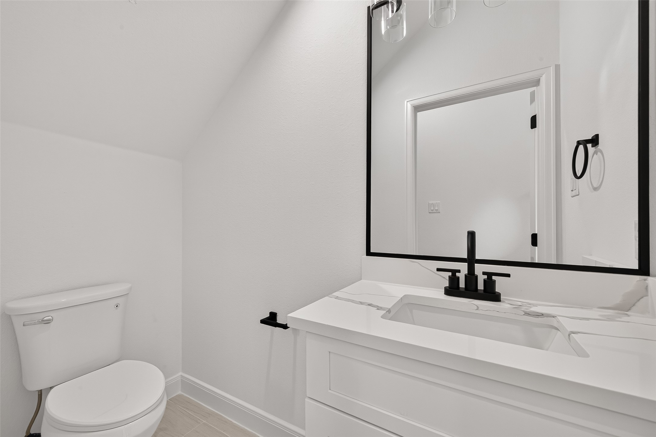 8110 Carver Road Houston, TX 77088 - Photo 13 of 38 Convenient downstairs half bath adds functionality for everyday living and guests without requiring access to the upstairs bedrooms.