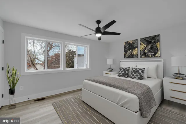 a bedroom with a large bed and a window