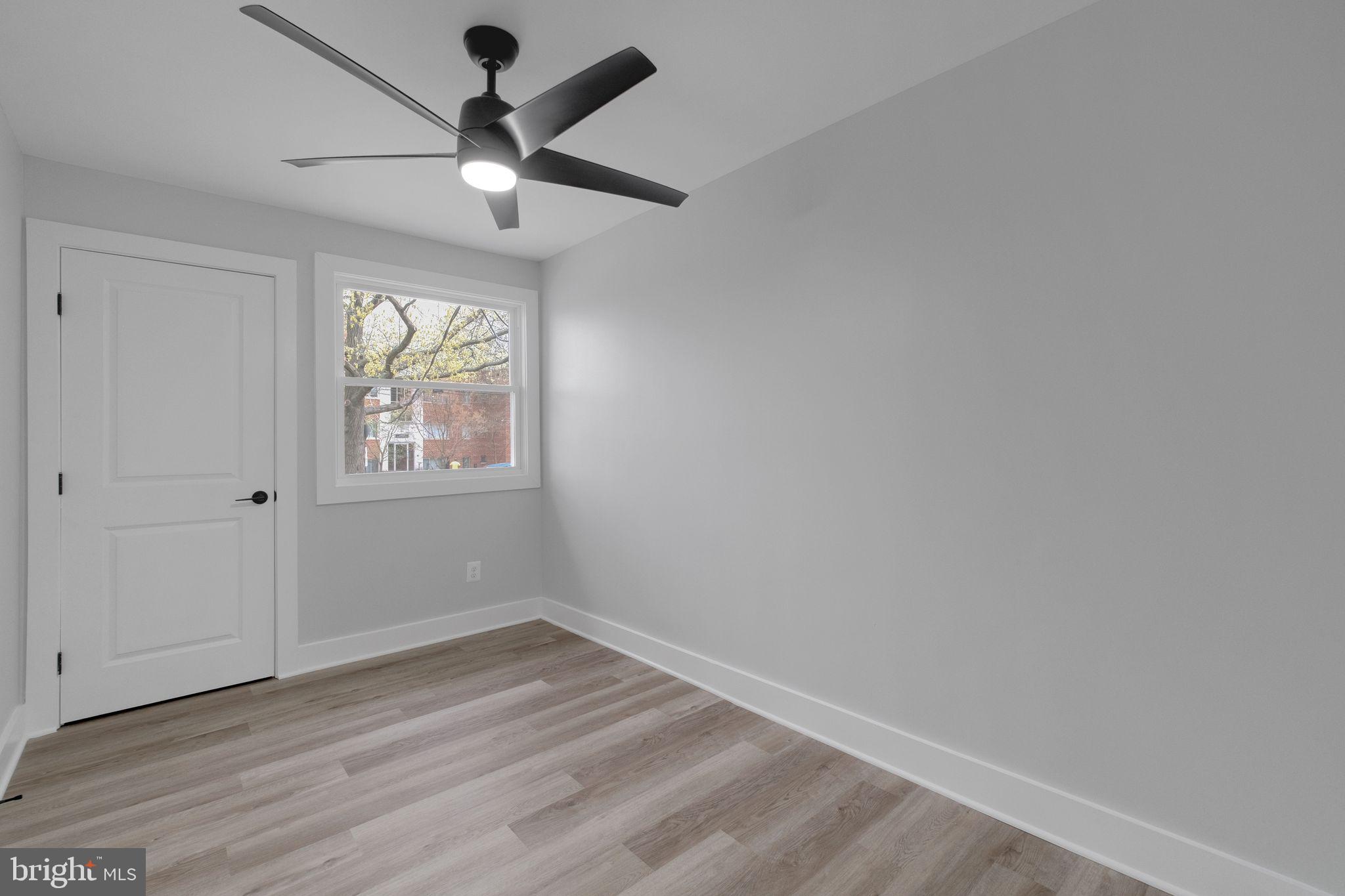 2503 Naylor Road Southeast Washington, DC 20020 - Photo 18 of 31 an empty room with wooden floor and windows