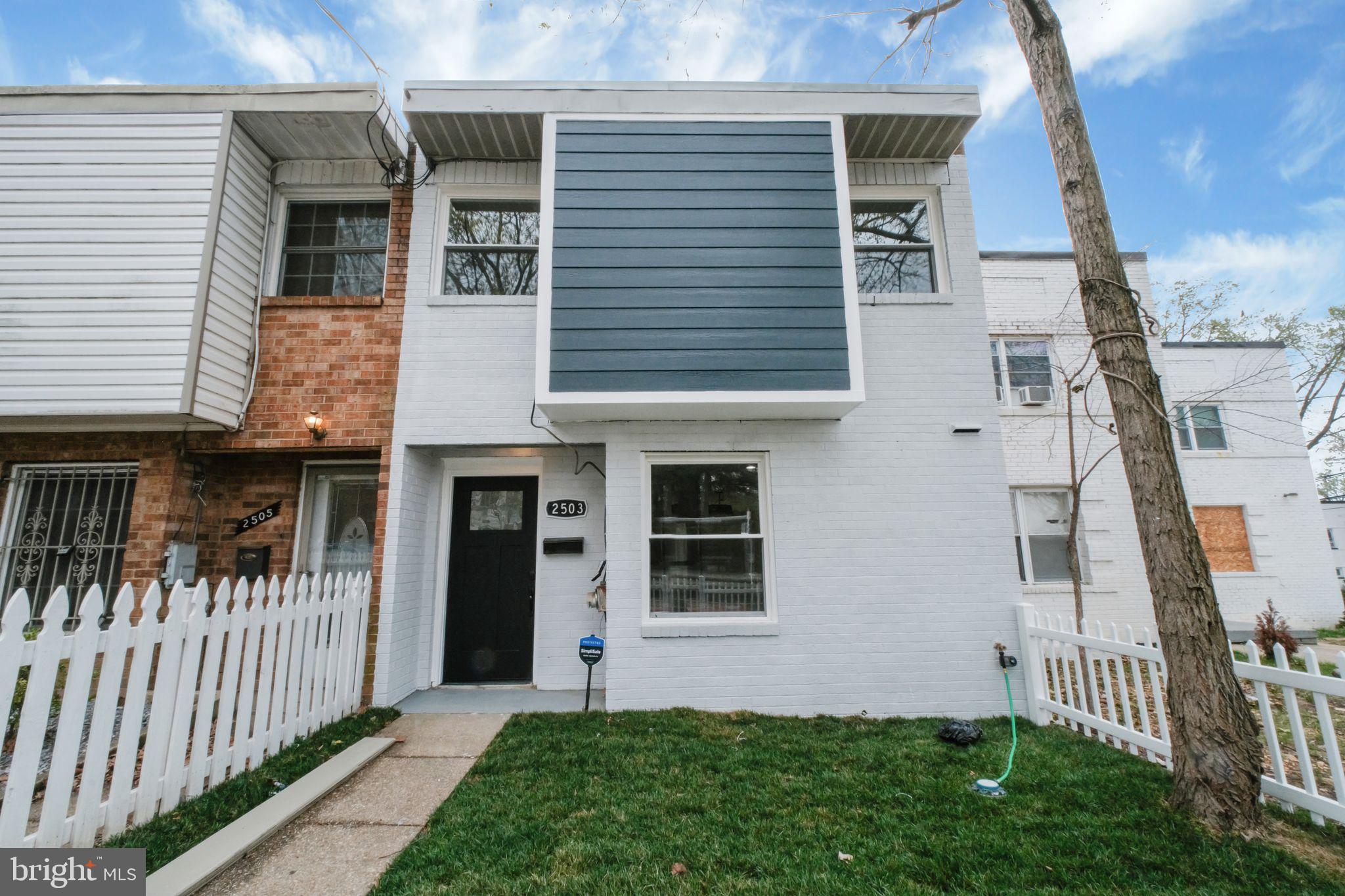 2503 Naylor Road Southeast Washington, DC 20020 - Photo 2 of 31 a front view of a house with a garden