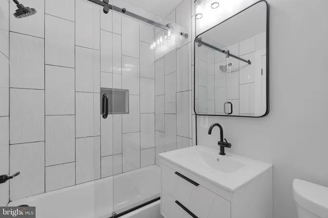 a bathroom with a sink and mirror